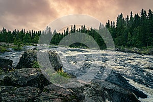 Twilight Above the Rapids Amidst Boulders in Dalarna, Sweden