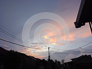 Twilight In The Afternoon In Residential Areas And Electricity Poles With Cables Belonging To Residents