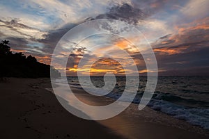 Twilight evening sunset. Waves, surf, swash at empty beautiful sandy beach on Foa island, Haapai, Tonga, Polynesia, Oceania.
