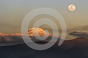 Twilight, full moon and clear sky on the Cayambe volcano