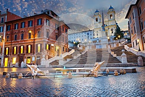 Twilight near the Spanish Steps and the Fontana della Barcaccia in Piazza di Spagna, Rome, Italy photo