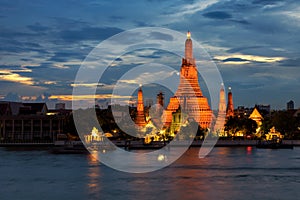 Twilight time of Wat Arun across Chao Phraya River in Bangkok, T