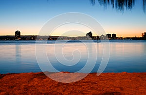 Twilight view across Nerang River to Southport from The Spit at Surfer`s Paradise photo