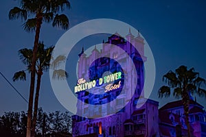 The Twilight zone Tower of Terror and palm trees on blue sky background in Hollywood Studios at Walt Disney World  3