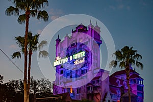 The Twilight zone Tower of Terror and palm trees on blue sky background in Hollywood Studios at Walt Disney World  6