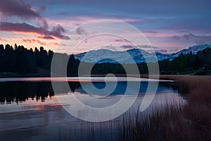 Twilights beauty captured in serene sky lake juxtaposition