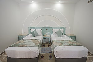 Twin beds in a luxury suite of a hotel room