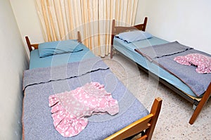 Twin beds in simple motel room