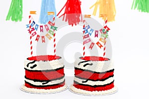 Twin birthday cakes with banners