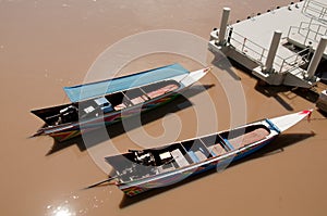 Twin boat in the chocolate color river