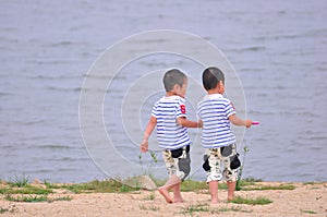 Twin brothers at the beach