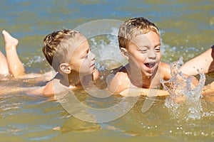 Twin brothers learn to swim