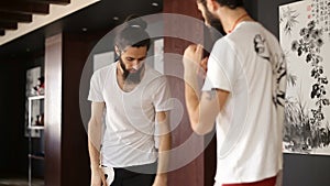 Twin brothers practice in Chinese martial arts in the training hall