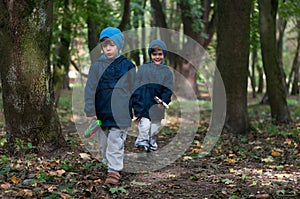 Twin brothers strolling in the woods