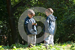 Twin brothers in the woods