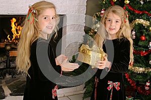 Twin children opening presents