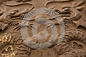 Twin dragons in stone relief photo