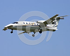 Twin engine Piaggio P.180 Avanti aircraft with nose canards on approach