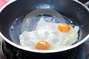 Twin fried eggs on the pan