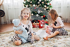 Twin little girls with presents