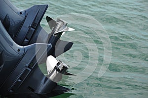 Twin outboard props on a boat in the water