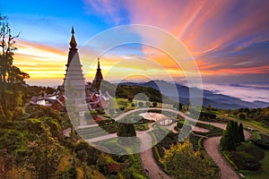 Twin pagoda in doi Inthanon national park with sunrise and morning mist at Chiang mai