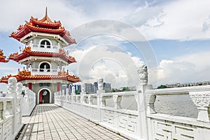 The Twin Pagodas on Jurong Lake, in the Chinese Garden with cloudy sky in Singapore