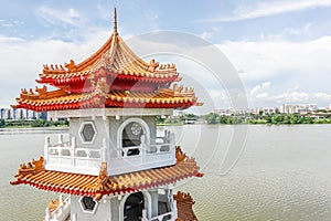 The Twin Pagodas on Jurong Lake, in the Chinese Garden with cloudy sky in Singapore