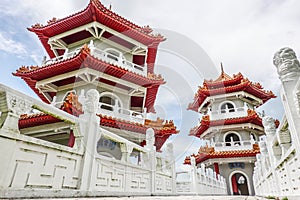 The Twin Pagodas on Jurong Lake, in the Chinese Garden with cloudy sky in Singapore