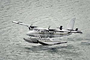 Twin propeller engine hydroplan taking off