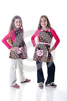 Twin sisters in polka dot aprons