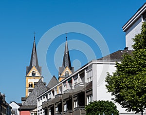 The twin steeples of Saint Florian\'s church in Koblenz, Germany on a bright, sunny day