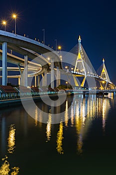 Twin suspension bridged crossing Bangkok river at twilight, Thailand