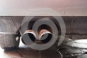 Twin tailpipe on the car photo