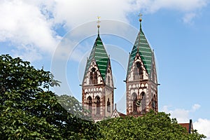 Twin towers of the Sacred Heart Church Herz-Jesu-Kirche in Freiburg im Breisgau, Baden-Wuerttemberg, Germany