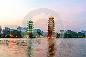 Night view of sun and Moon Twin Towers in Guilin, Guangxi Province, China photo