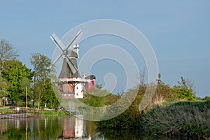 Twin windmills in Greetsiel in spring