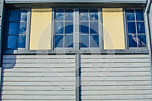 The twin windows on old timber house.