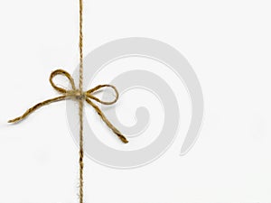 Twine tied in a bow isolated on white background