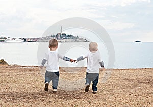 Twins on a beach Rovinj. Croatia.