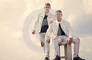 twins brother in white. male beauty and fashion. similar appearance. family relations