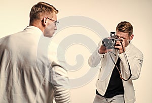 twins brother in white. photographing. beauty and fashion. similar appearance. male friendship