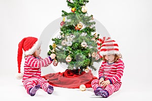 Twins and a Christmas tree