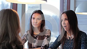 Twins listen carefully her girlfriend and shocking in cafe