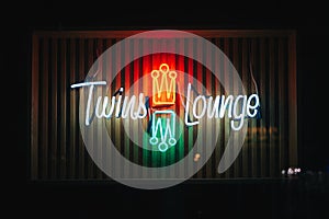 Twins Lounge vintage neon sign at night, in Greenpoint, Brooklyn, New York