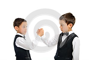 Twins playing arm wrestling isolated