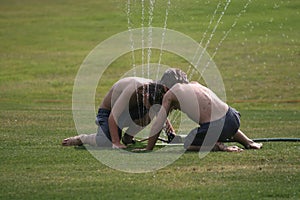 Twins in Sprinkler