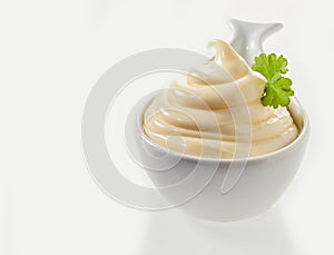 Twirled spicy mayonnaise served in a spoon photo