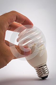 Twist light bulb on white background