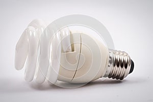 Twist light bulb on white background